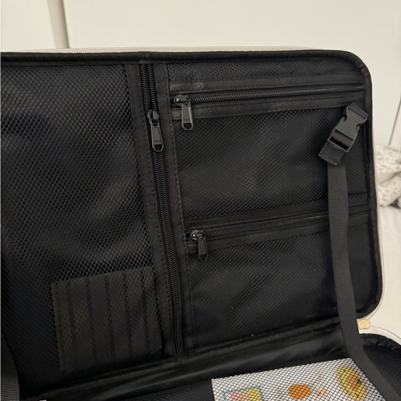 has attachable strap, organizers, holds makeup brushes. many zips & compartments - Picture 3 of 3